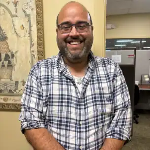 A man smiling at camera.